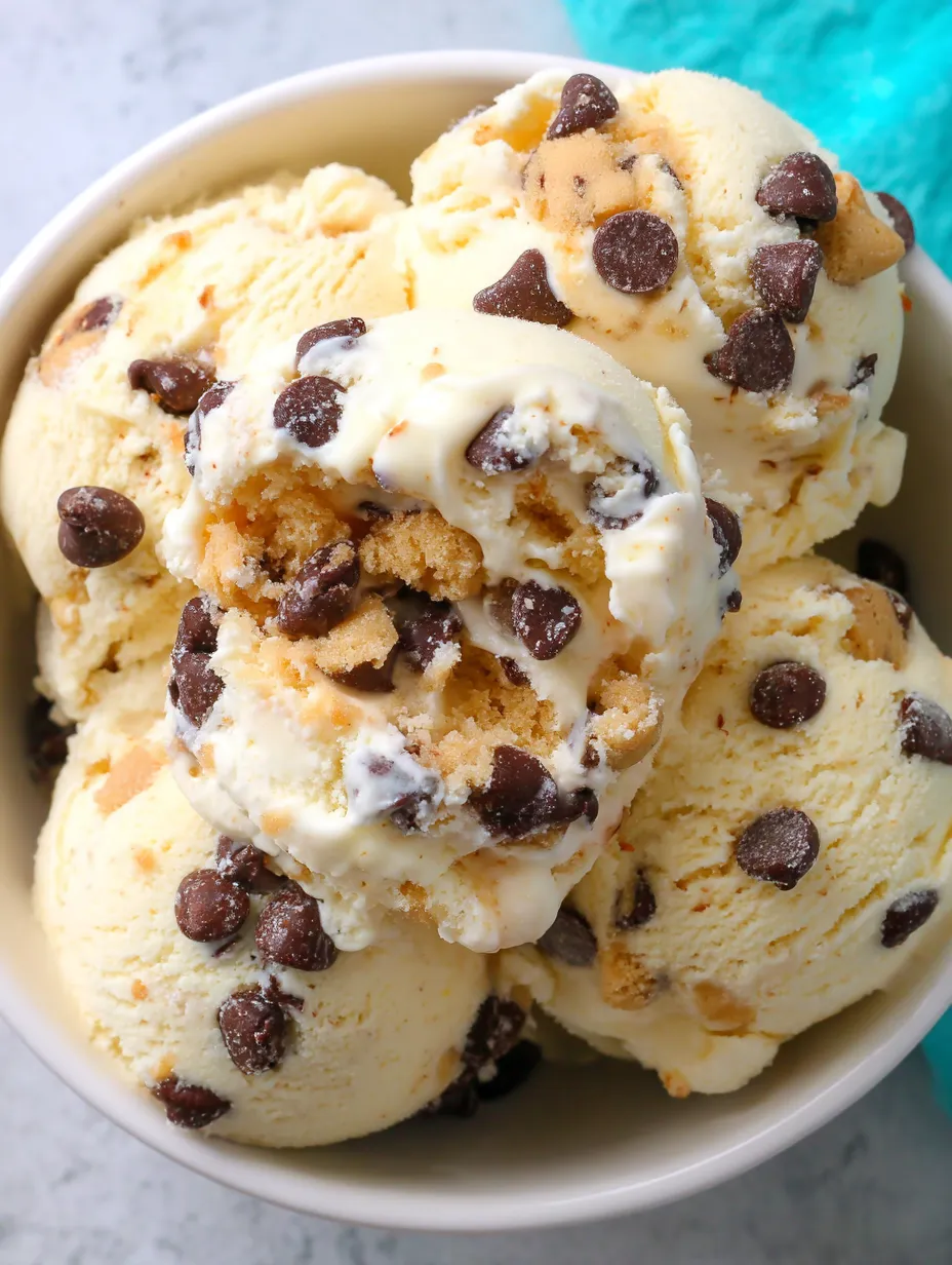 A bowl of ice cream with chocolate chips.